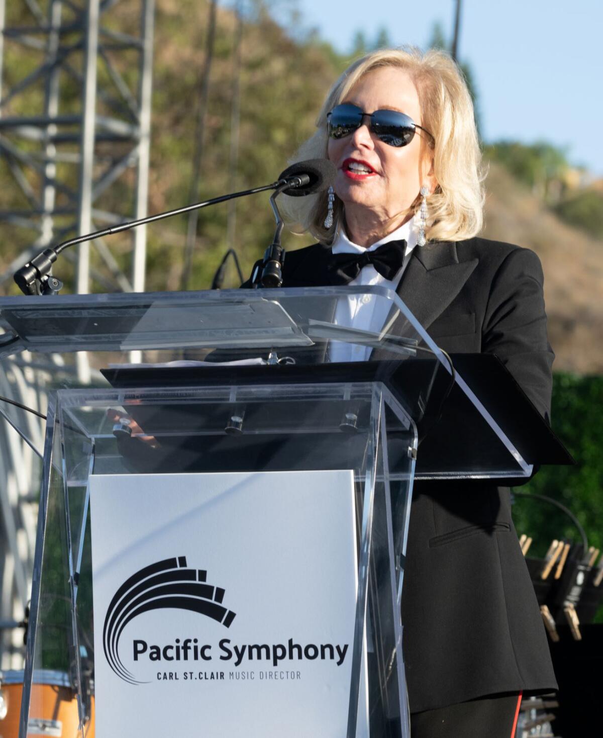 The Pacific Symphony Orchestra Gala Co-Chair Judy Whitmore welcomes party-goers at 2022 event "A Night In Old Hollywood."
