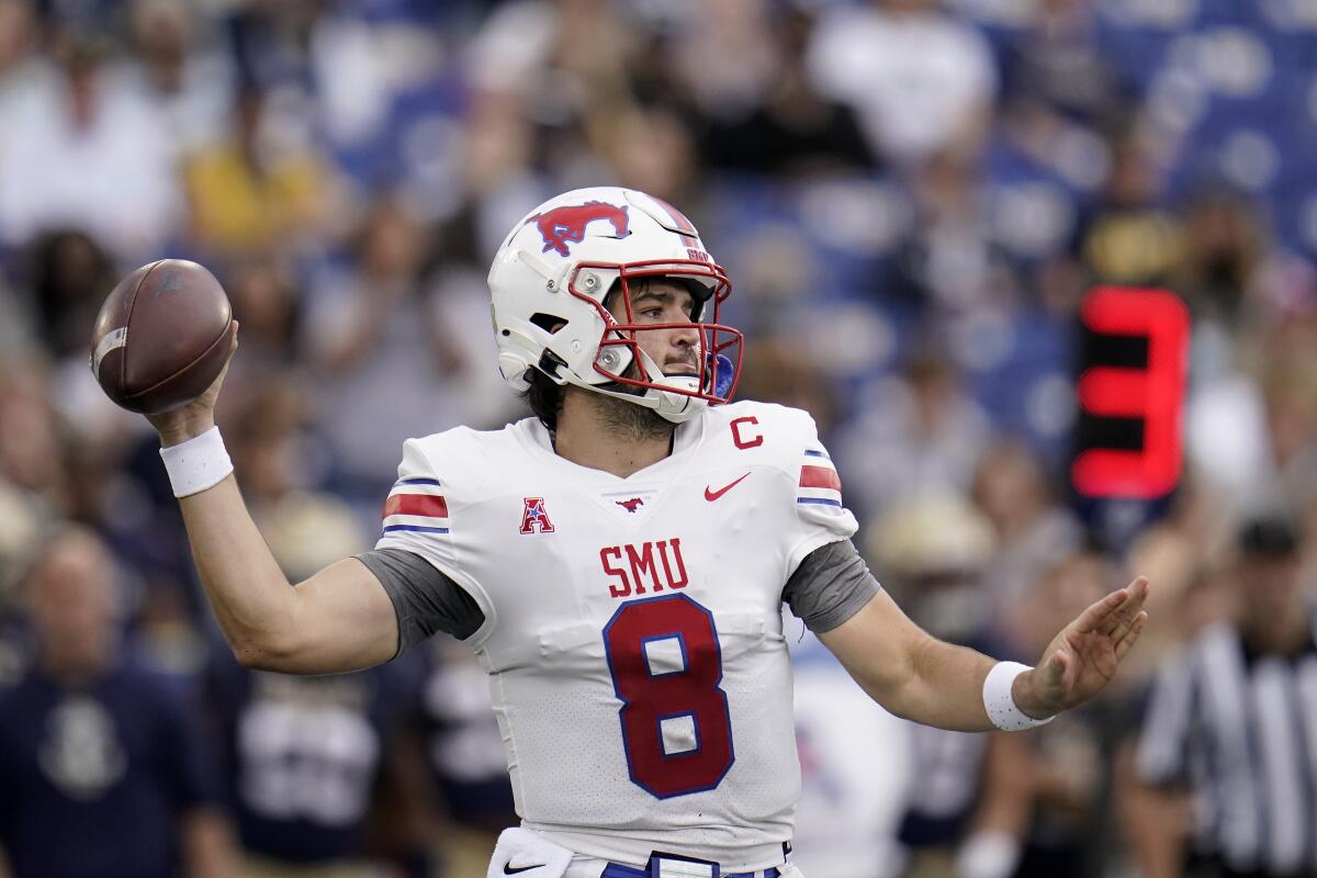 SMU quarterback Tanner Mordecai throws a pass against Navy during the first half of an NCAA college football game, Saturday, Oct. 9, 2021, in Annapolis, Md. (AP Photo/Julio Cortez)