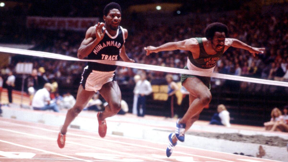 Houston McTear, left, competes in the Sunkist Invitational at the Los Angeles Sports Arena in 1982.