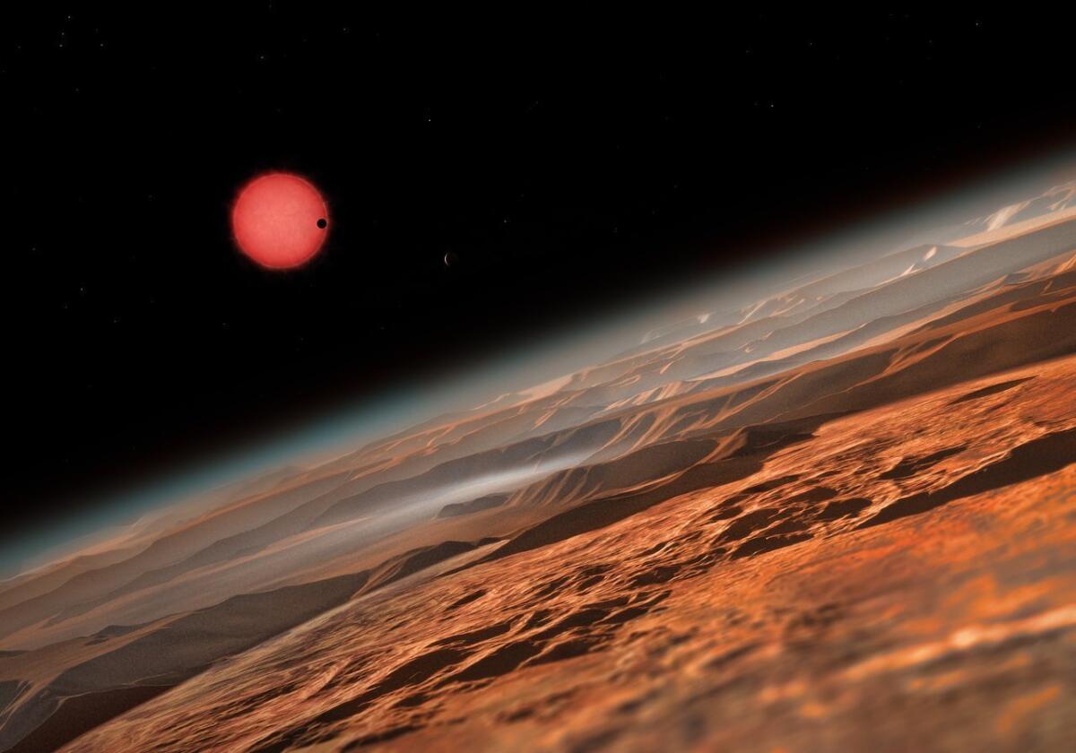 An artist's impression of the ultracool dwarf star TRAPPIST-1 as seen just above the surface of one of its three known planets.