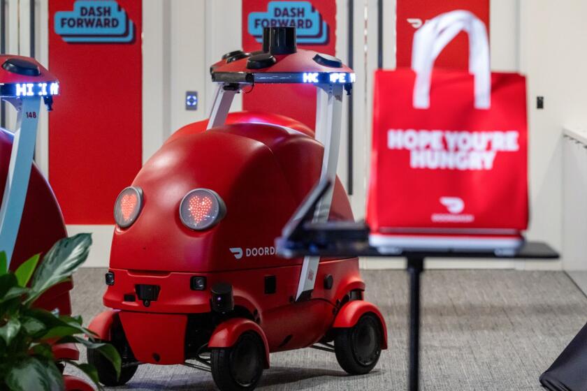Dot, an autonomous delivery bot developed by DoorDash , during an unveiling event at the company’s headquarters in San Francisco on Sept. 29, 2025. Photographer: David Paul Morris/Bloomberg