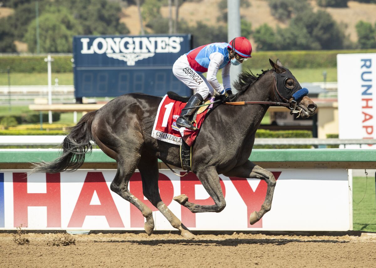 File-This Sept. 26, 2020, file photo provided by Benoit Photo, Princess Noor and jockey Victor Espinoza are seen winning the Grade II, $200,000 Chandelier Stakes, at Santa Anita Park in Arcadia, Calif. Princess Noor, one of the top 2-year-old fillies in the country, was retired Sunday because of a soft tissue injury sustained while leading the $300,000 Starlet Stakes at Los Alamitos. (Benoit Photo via AP, File)