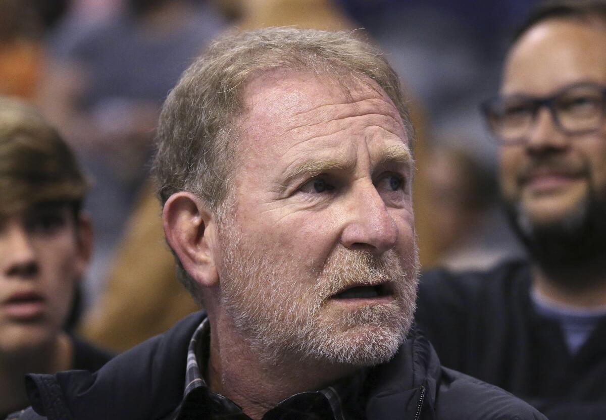 Suns owner Robert Sarver sits courtside during a game in 2019.