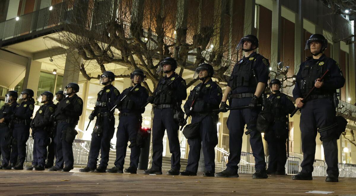 UC Berkeley police officers guard the building where then-Breitbart News editor Milo Yiannopoulos was to speak in February 2017. The speech was canceled.