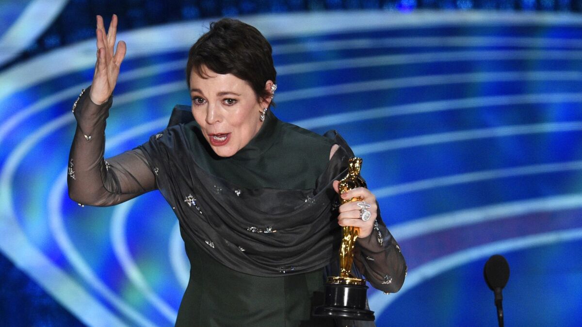 Olivia Colman reacts as she accepts the award for best performance by an actress in a leading role for "The Favourite" at the Oscars on Sunday, Feb. 24, 2019, at the Dolby Theatre in Los Angeles.