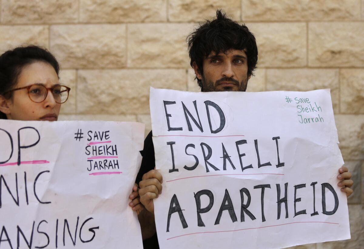 Protesters holding signs