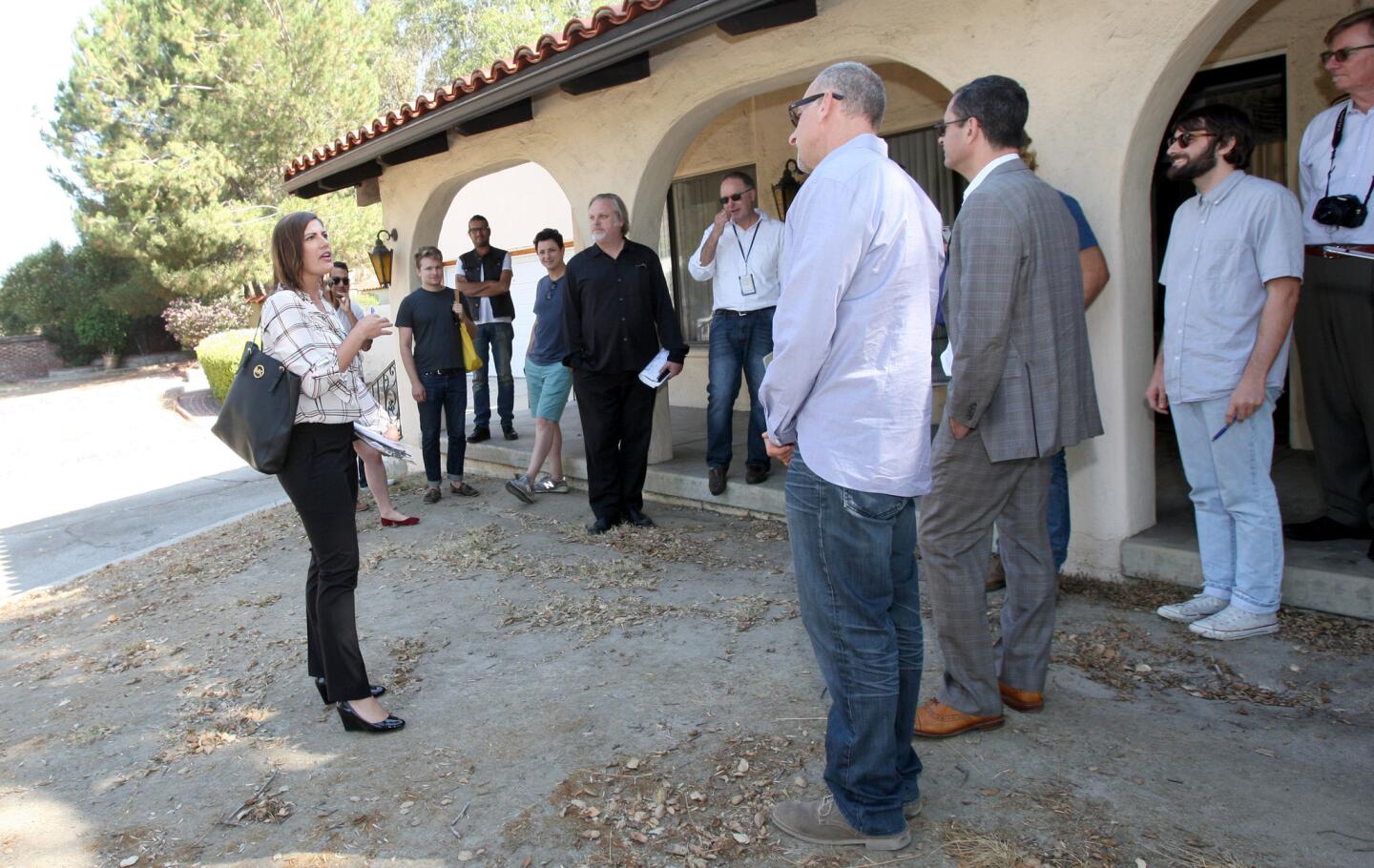 The city of Glendale's principal Economic Development Officer Jennifer McLain, left, lead a tour of Rockhaven for prospective developers, on Honolulu Ave. in Montrose on Thursday, June 30, 2016. The former sanitarium property is up for sale and about 5 groups representing various developers and architects toured the property's buildings.