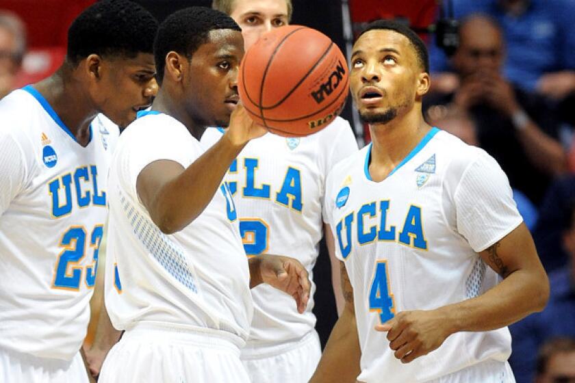 Bruins guards Jordan Adams (with ball) and Norman Powell (4) combined for nearly 29 points a game last season.