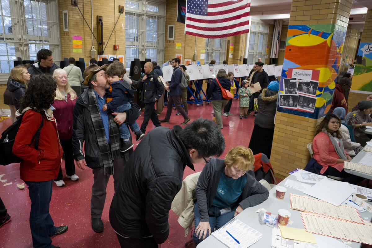Voters line up at a polling station in the New York City borough of Brooklyn.