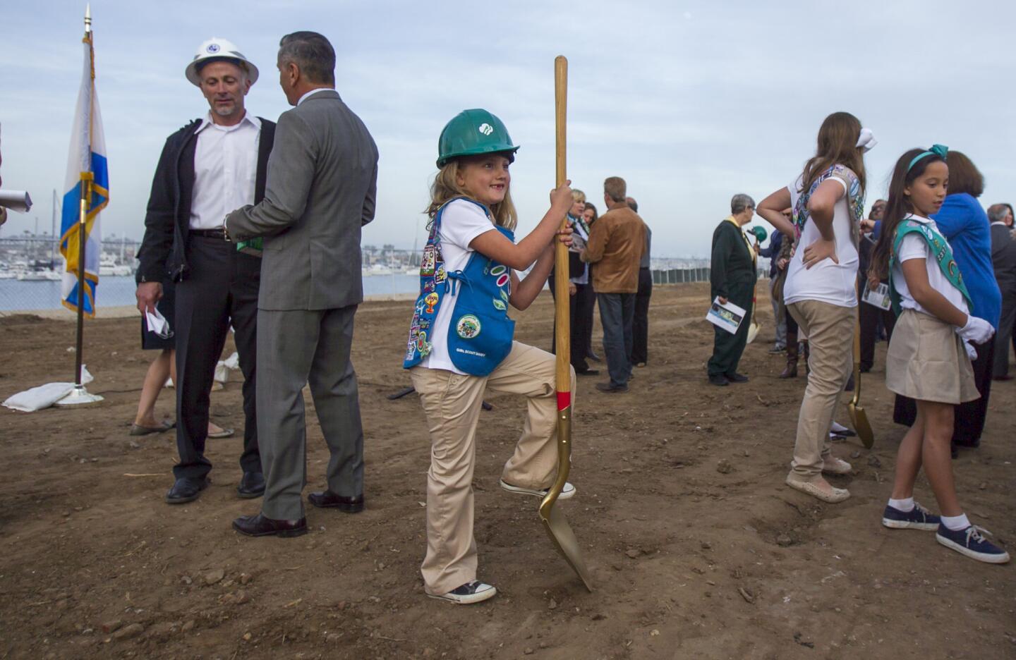 Girl Scout Frankie Paalman poses for a photo op during the groundbreaking ceremony for Marina Park on Balboa Peninsula on Tuesday, February 11. (Scott Smeltzer, Daily Pilot)