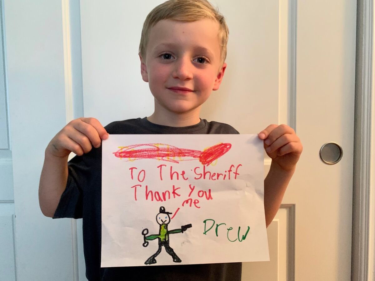 Drew Carlin with the art appreciation message he made for the sheriff’s deputies.