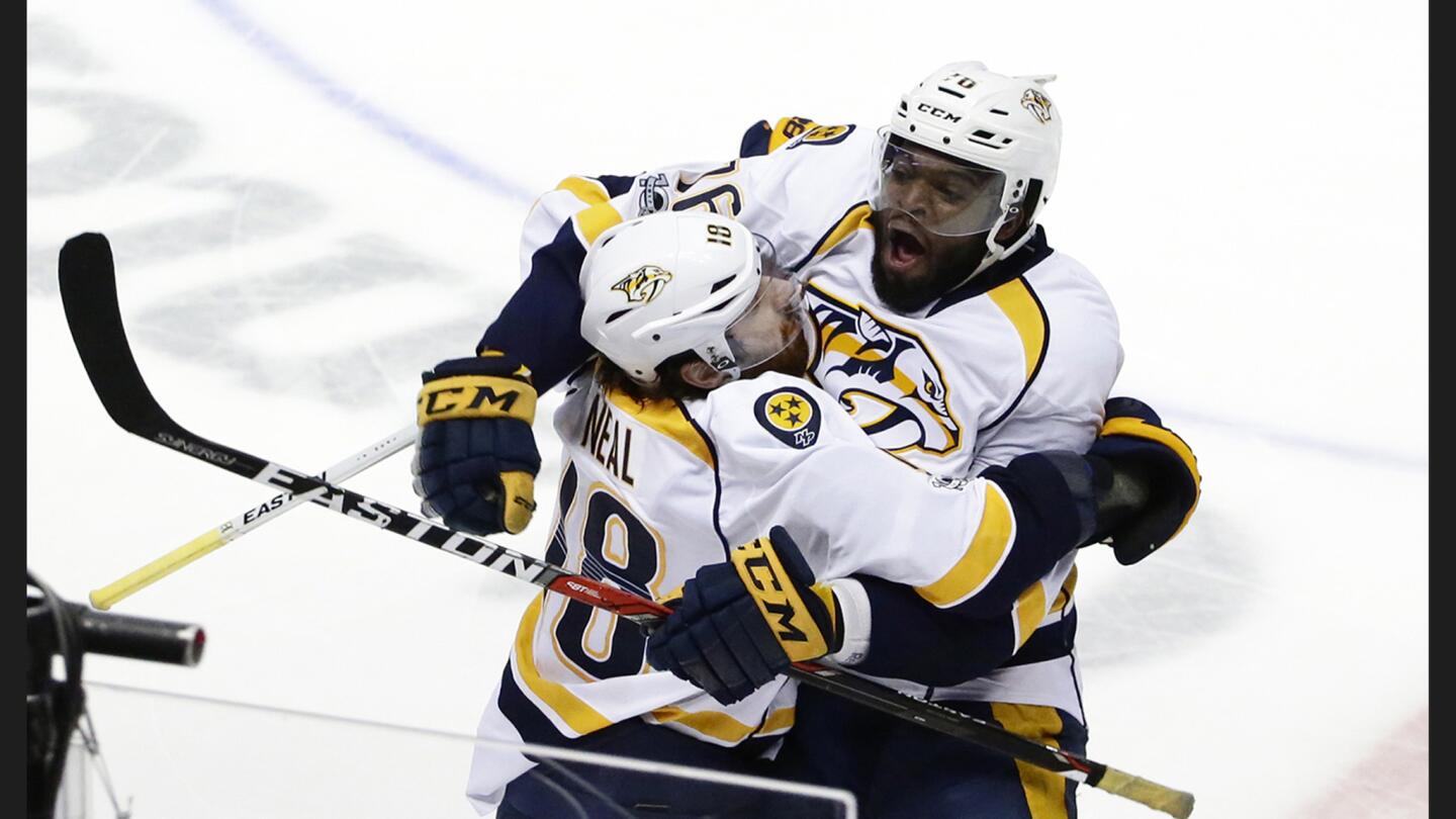 Predators forward James Neal is embraced by teammate PK Subban, right, after scoring the game-winning goal against the Ducks in Game 1 of the Western Conference finals.