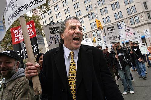 Richard Castellano, a member of the Screen Actors Guild, has been supporting the writers strike for a full week now. He joined the picket line at New York's financial district.