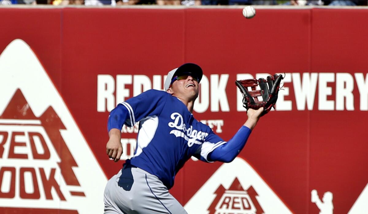 Enrique Hernandez, playing center field for the Dodgers during an exhibition game on March 15, robs the Seattle Mariners' Mike Zunino of an extra-base hit.