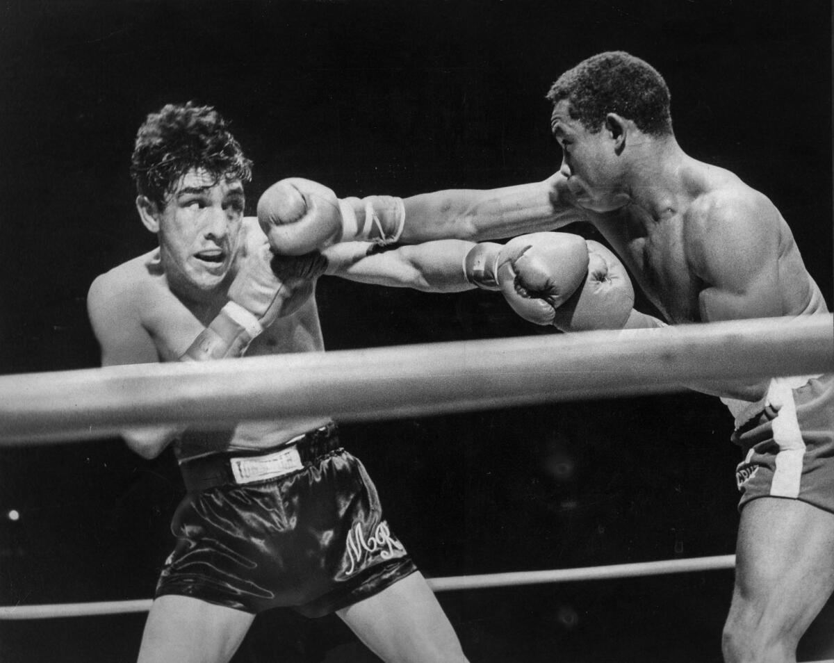 Sept. 27, 1968: Mando Ramos, left, and Carlos Teo Cruz during lightweight boxing championship at the Coliseum. Cruz won on an unanimous decision.