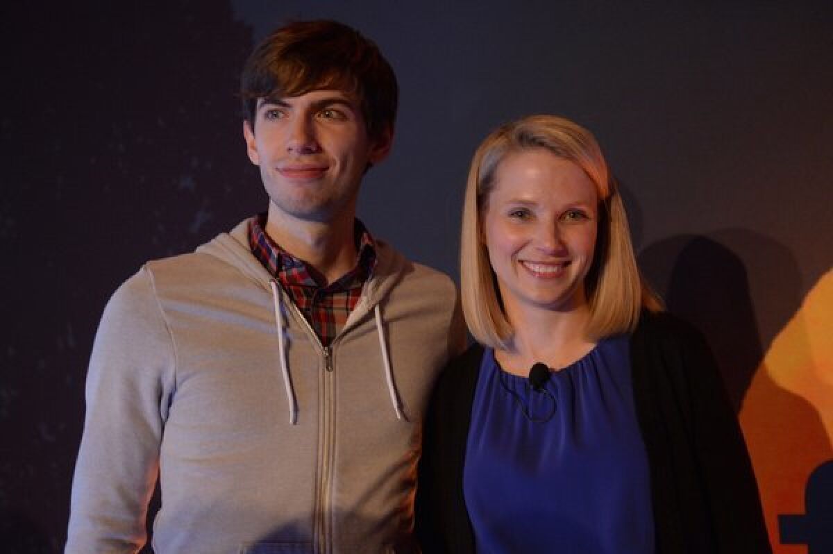 Yahoo CEO Marissa Mayer and Tumblr founder David Karp pose for a photo after announcing Yahoo's purchase of Tumblr.