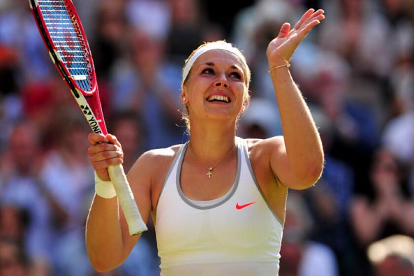 Sabine Lisicki celebrates after defeating Agnieszka Radwanska in a Wimbledon women's semifinal match on Thursday.