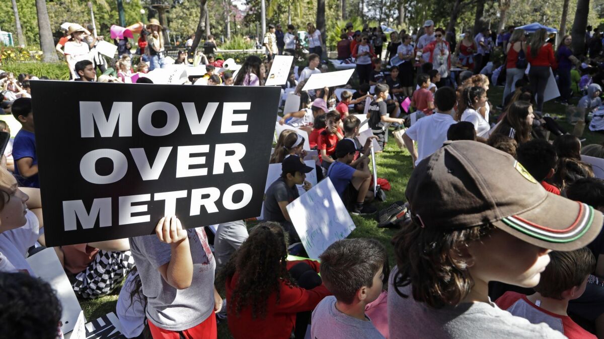Several hundred students from Beverly Hills schools held a rally at Will Rogers Memorial Park to voice their opposition to Metro's planned subway route under Beverly Hills High School.