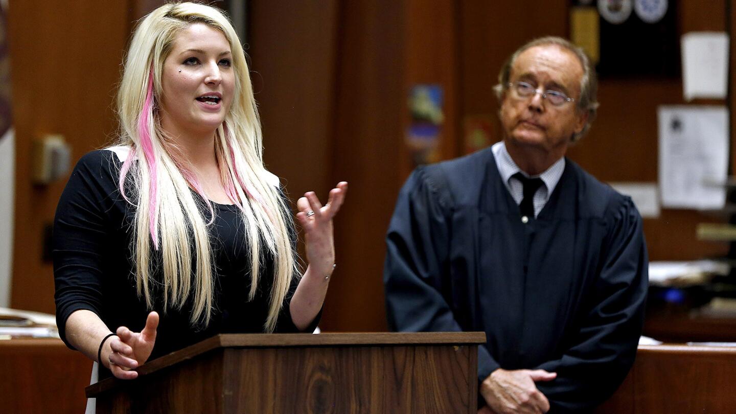 Mariann Avery of Tarzana spent 15 months in the drug court program before graduating. She described to the crowd how it changed her life. Watching is Judge Michael Tynan.