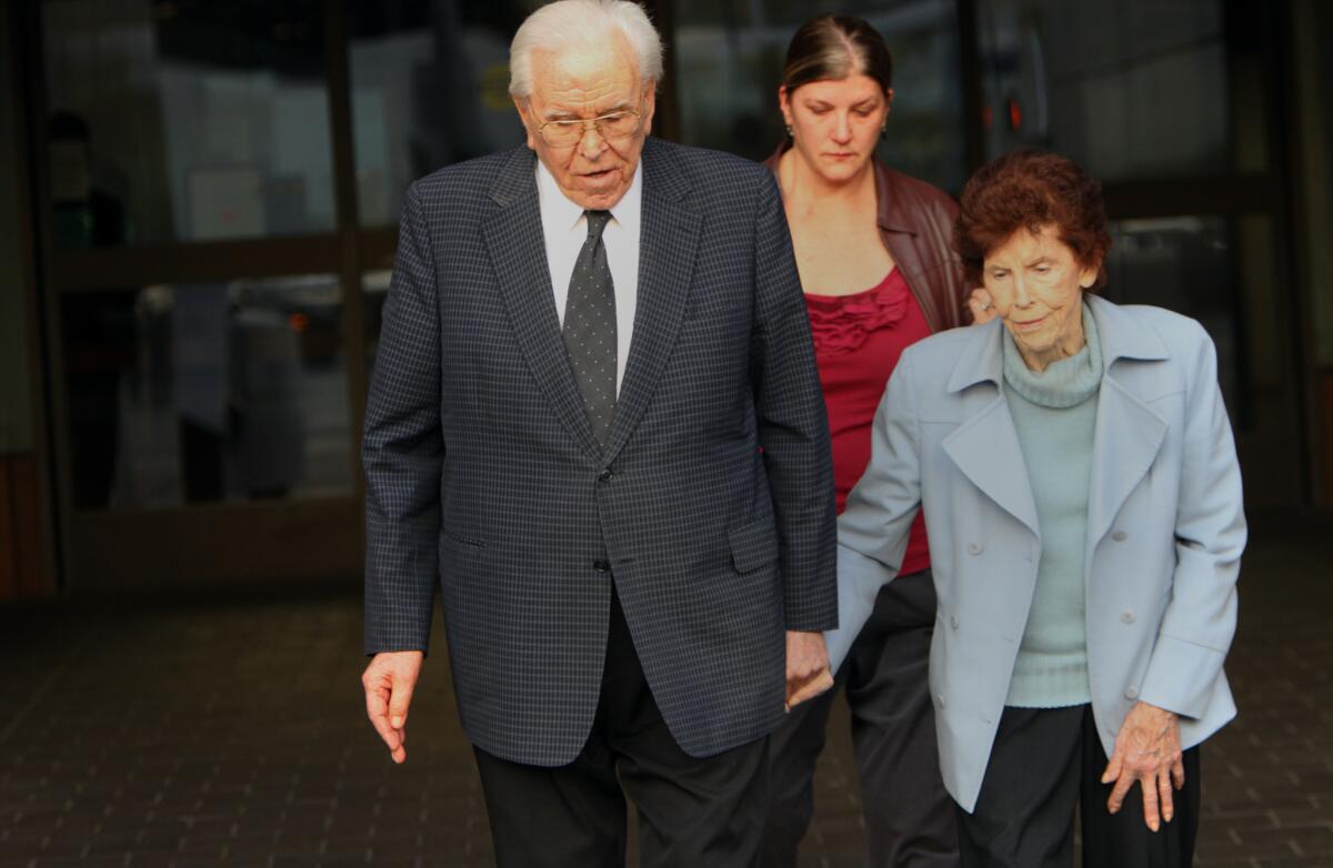 Robert Schuller and his wife, Arvella, with daughter Carol Milner, walk out of the Edward Roybal Federal Building in November 2012. The three were present for proceedings related to the Crystal Cathedral's bankruptcy.