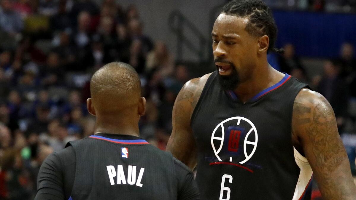 Center DeAndre Jordan (6) talks to teammate Chris Paul during the first half of a game against the Dallas Mavericks, which was the last team the Clippers defeated.