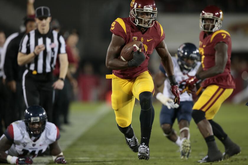 USC receiver Juju Smith-Schuster sprints toward the end zone after a catch against Arizona on Nov. 7.