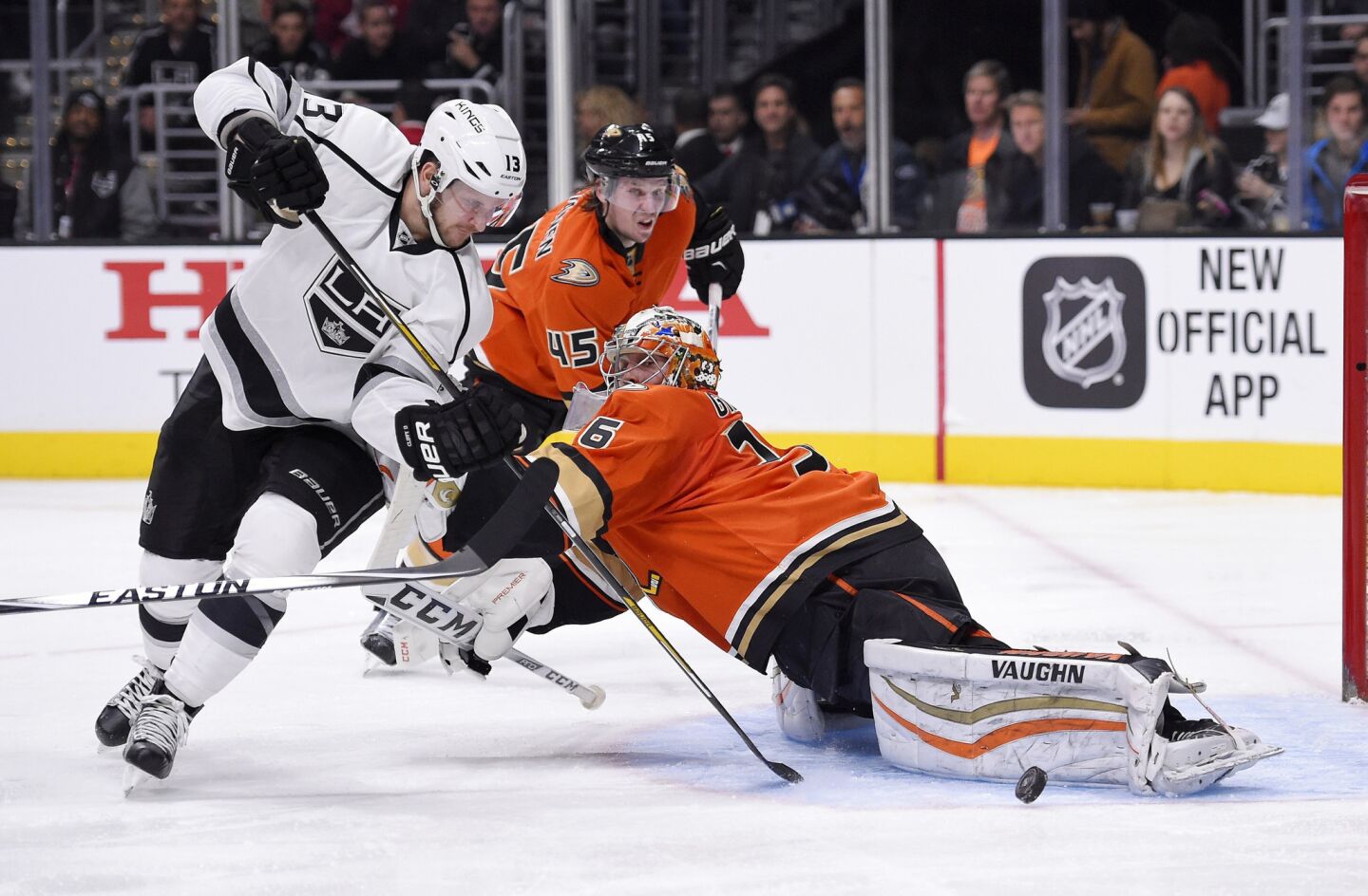 Kings left wing Kyle Clifford tries to beat Ducks goalie John Gibson and defenseman Sami Vatanen during the second period.