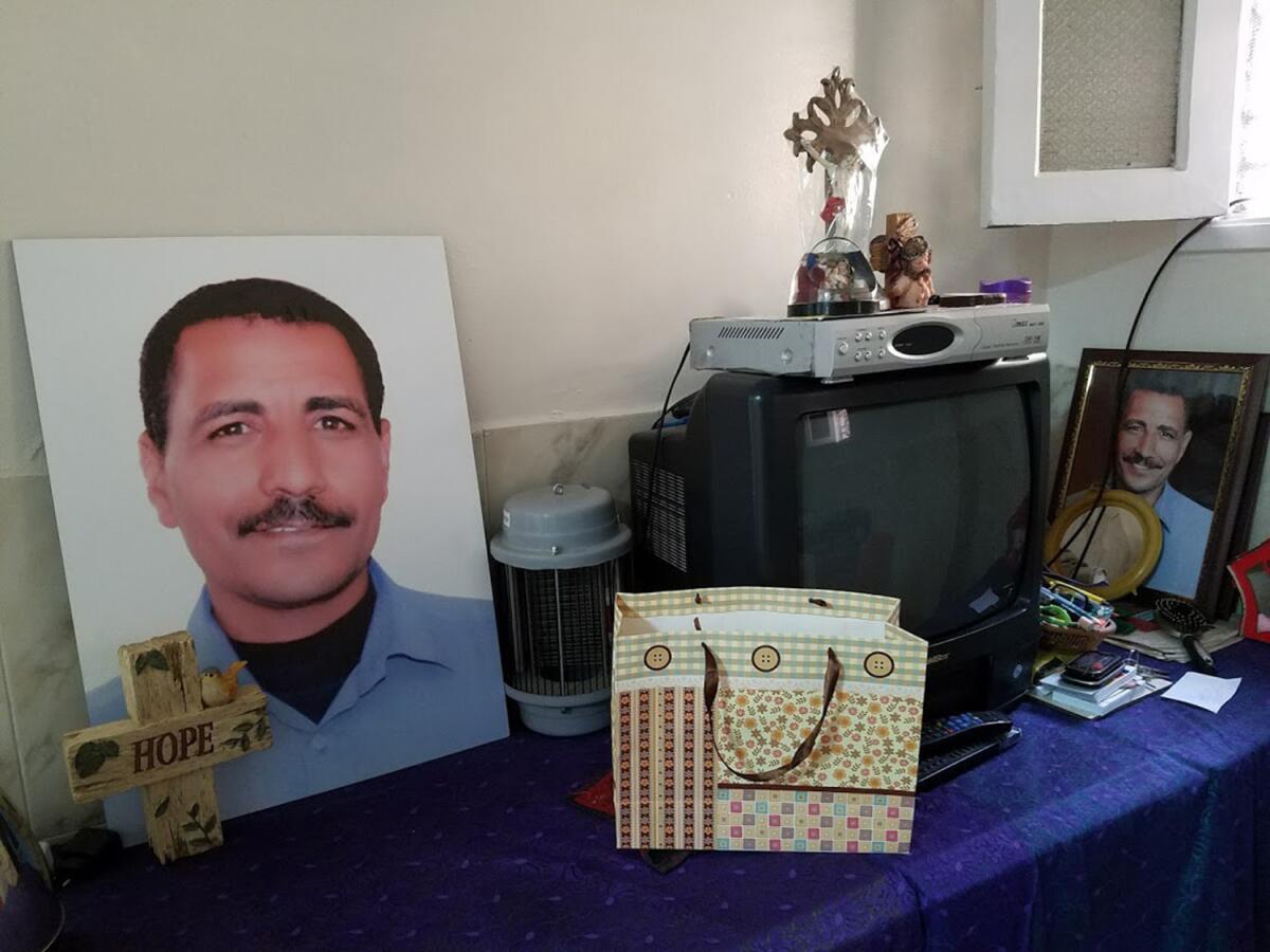 Portraits are set up in the home of Nabil Habib, 48, a church guard killed in an attack during Mass Dec. 11 at St. Mark's Cathedral in Cairo.