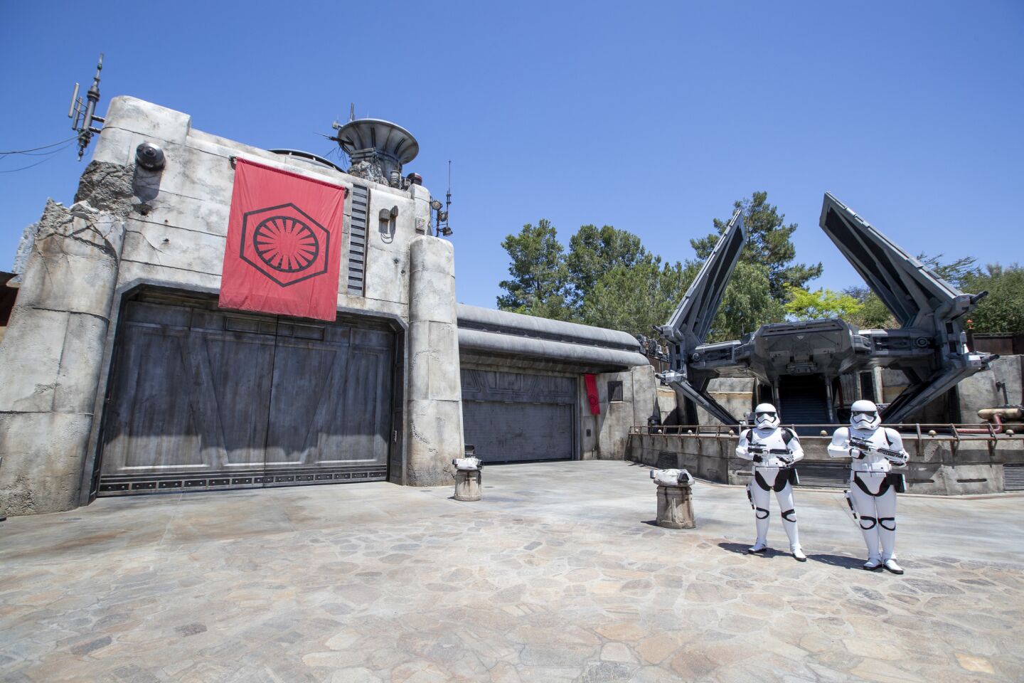 Storm Troopers patrol The First Order Outpost where the Tie Echelon fighter ship is parked.