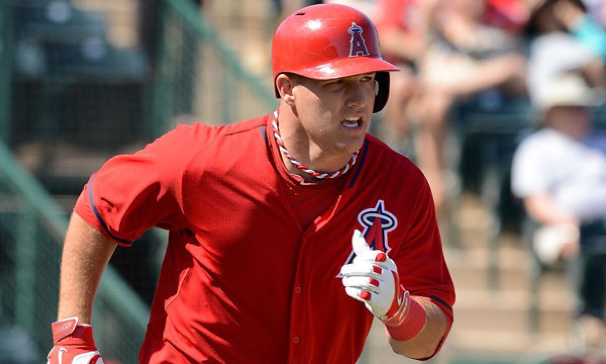 Angels outfielder Mike Trout runs to first base during a Cactus League game against the Chicago Cubs on March 7. Trout hit a home run in Saturday's 4-4 exhibition tie against the Colorado Rockies.