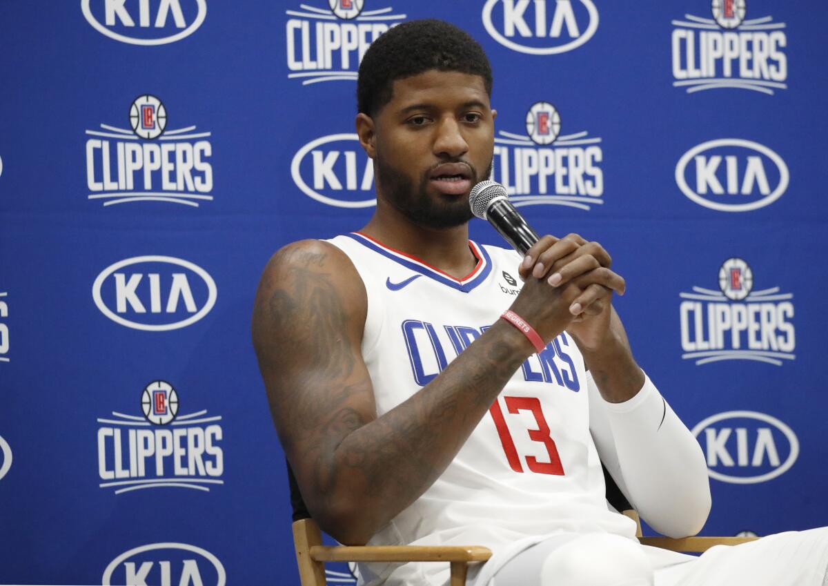 Paul George speaks during Clippers media day on Sunday in Playa Vista.