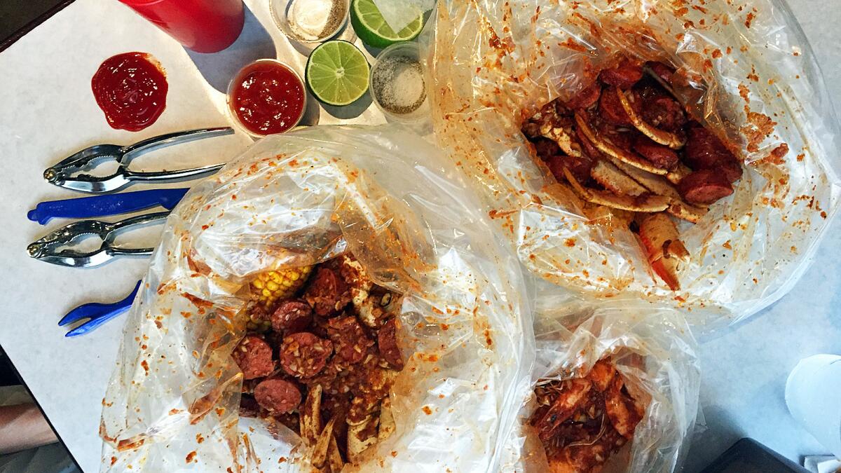 Bags of crab, shrimp and sausage at Boiling Crab in Alhambra.