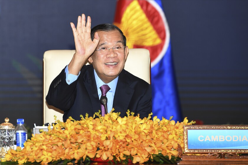 FILE - In this photo provided by the An Khoun Sam Aun/National Television of Cambodia, Cambodian Prime Minister Hun Sen gestures as he joins an online meeting of the ASEAN-China special summit at Peace Palace in Phnom Penh, Cambodia on Nov. 22, 2021. Prime Minister Hun Sen begins a visit to strife-torn Myanmar on Friday, Jan. 7, that he hopes will invigorate efforts by Southeast Asian nations to start a peace process, but critics say will legitimize the rule of the military that took power last year and its campaign of violence. (An Khoun SamAun/National Television of Cambodia via AP, File)