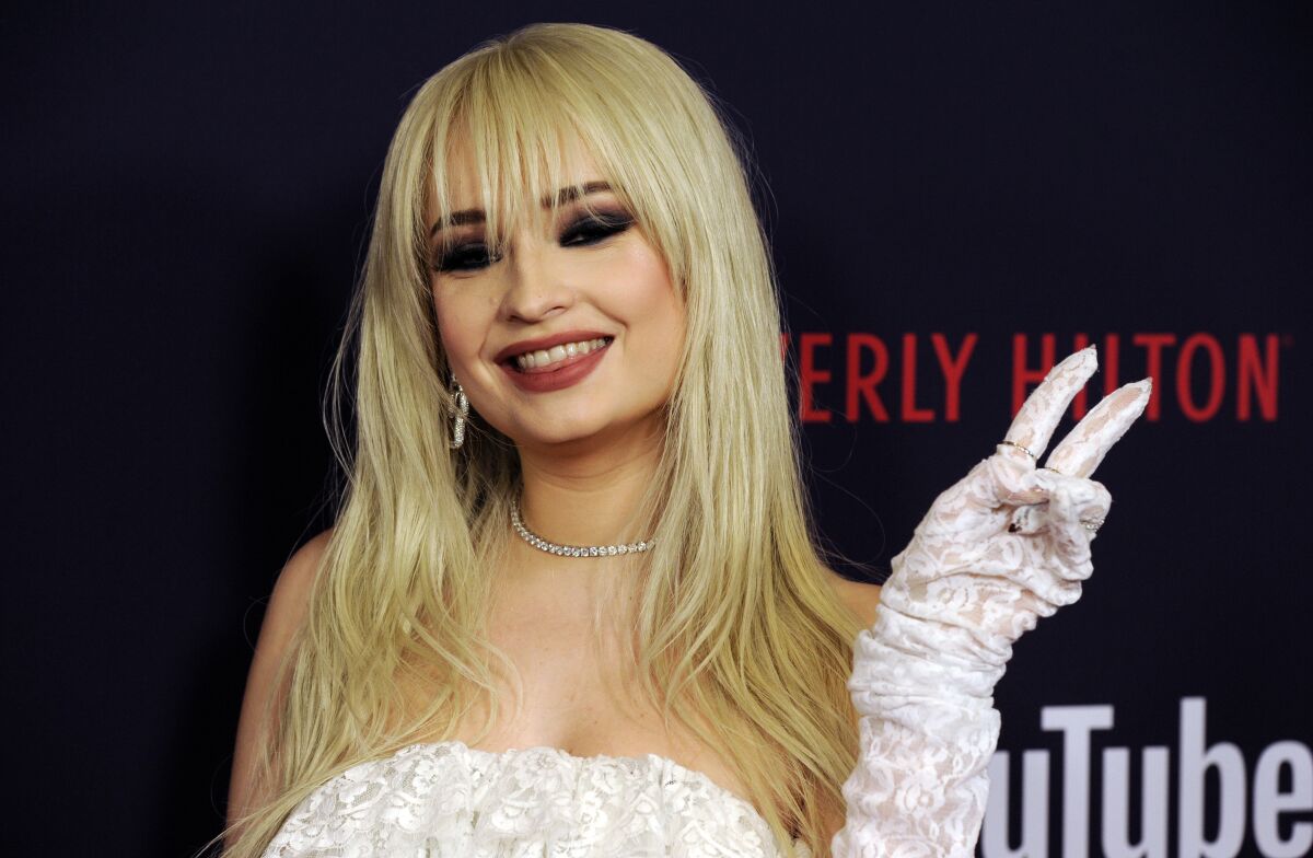 FILE - German singer-songwriter Kim Petras poses at the 2019 Streamy Awards on Dec. 13, 2019, in Beverly Hills, Calif. Petras is performing at the EMA ceremony in Budapest, Hungary, on Nov. 14 on the heels of the country's passage of legislation that critics say limits LGBTQ rights. (AP Photo/Chris Pizzello, File)