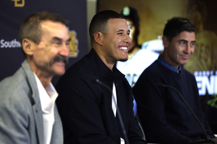 Scottsdale, AZ - February 27: San Diego Padres owner Peter Seidler and General Manager A.J. Preller smile during a news conference to announce Manny Machado's contract extension on Tuesday, February 28, 2023 in Scottsdale, AZ. (K.C. Alfred / The San Diego Union-Tribune)