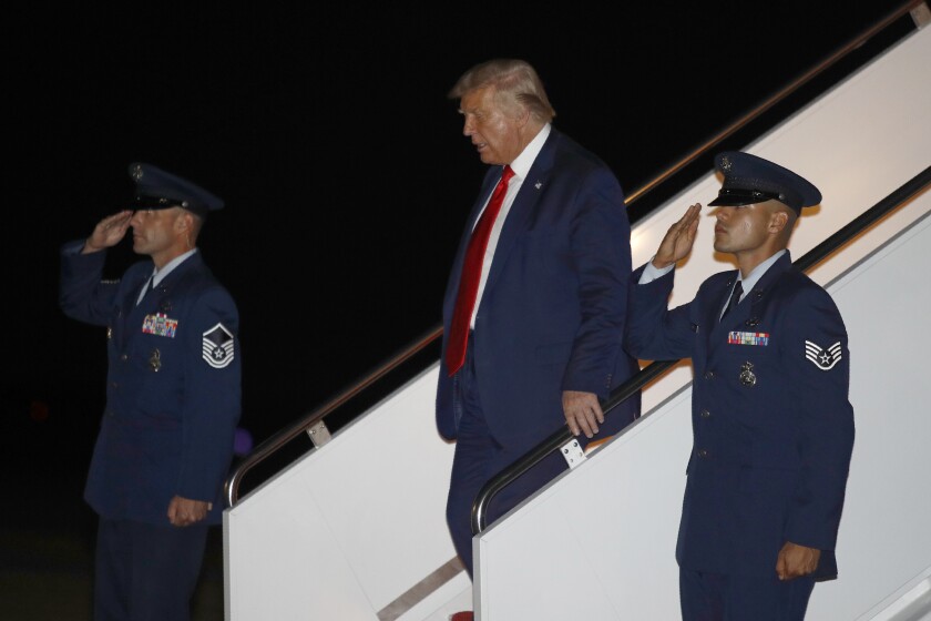 President Donald Trump steps off Air Force One at Andrews Air Force Base, Md., Friday, July 31, 2020. 