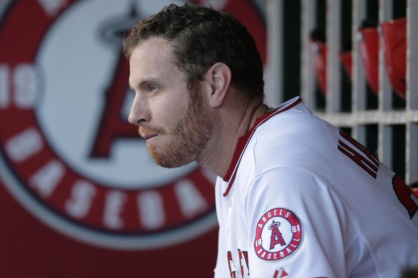 Angels outfielder Josh Hamilton sits in the dugout before Monday's game against the Baltimore Orioles.