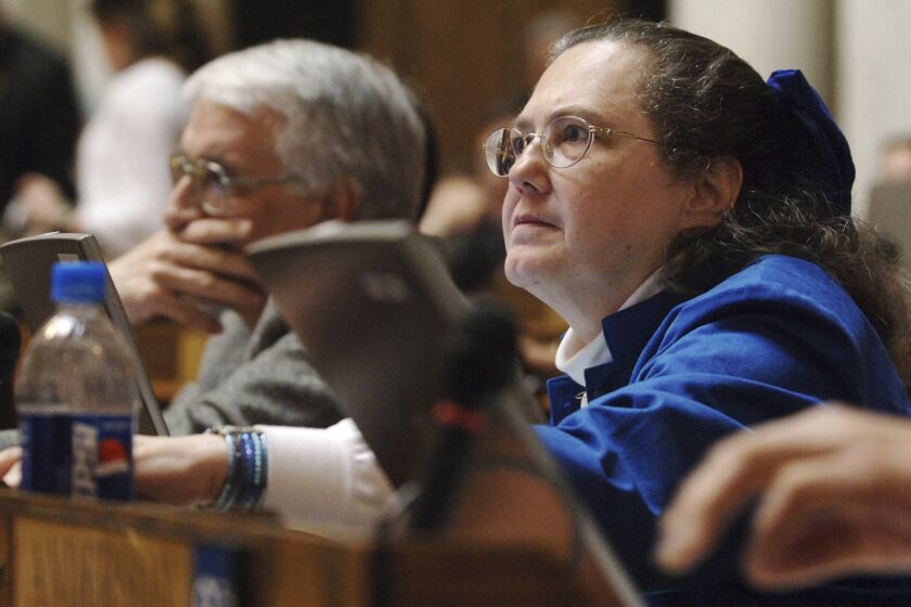 FILE - Delegate Ruth Rowan, right, R-Hampshire, votes on an amendment, Wednesday, March 16, 2005, at the Capitol in Charleston, W.Va. Lawmakers in West Virginia have introduced a bill to ban abortion after 15 weeks, a proposal nearly identical to the Mississippi law currently under review by the U.S. Supreme Court. On Tuesday, Jan. 18, 2022, Rowan, lead sponsor of the West Virginia bill, told The Associated Press that West Virginia has an obligation to protect the unborn as “a Christian state where people care about their families and their children.” (AP Photo/Jeff Gentner, File)