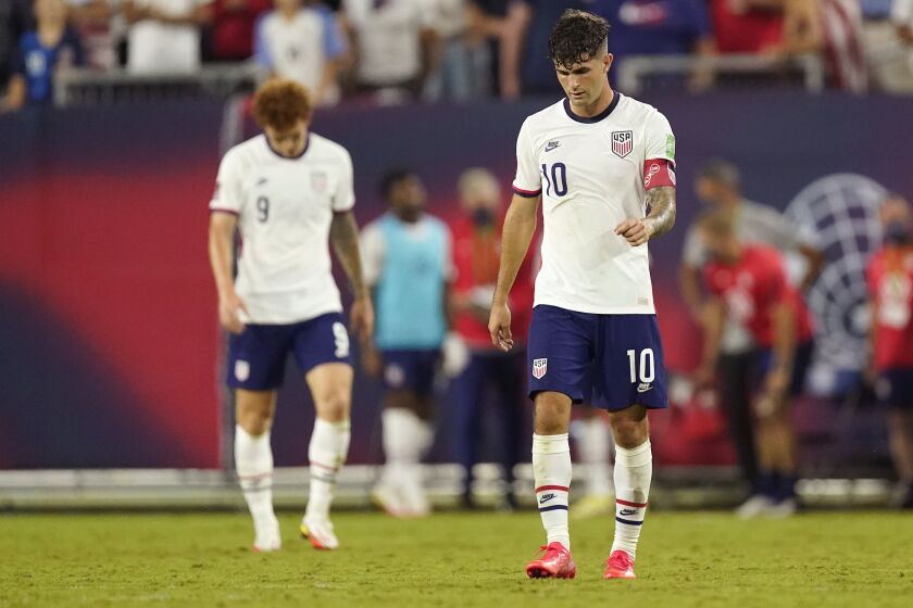 United States forwards Christian Pulisic (10) and Josh Sargent (9) leave the pitch following a 1-1 draw with Canada