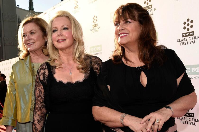 FILE - In this March 26, 2015, file photo, Heather Menzies-Urich, from left, Kym Karath and Debbie Turner, cast members in the classic film "The Sound of Music," pose together before a 50th anniversary screening of the film at the opening night gala of the 2015 TCM Classic Film Festival in Los Angeles. Menzies-Urich, who played one of the singing von Trapp children in the 1965 hit film, has died. She was 68. Menzies-Urichâs son, actor Ryan Urich, told Variety that his mother died late Sunday, Dec. 24, 2017, in Frankford, Ontario. She had been diagnosed with brain cancer.(Photo by Chris Pizzello/Invision/AP, File)