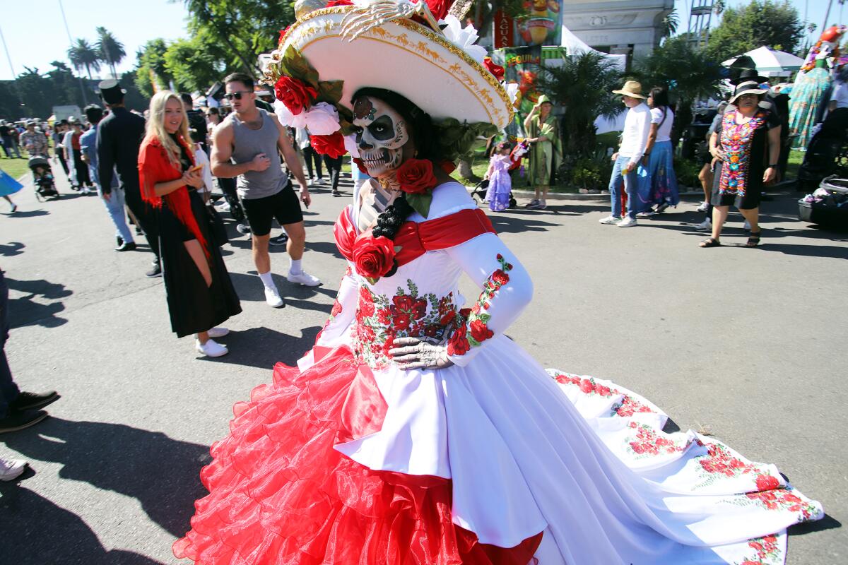 A woman dressed as a Catrina bride.