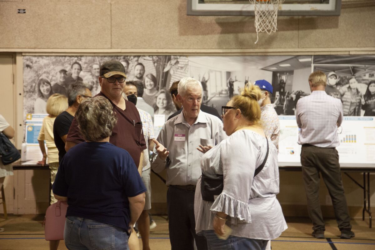 Residents discuss the city's College Area Community Plan Update at a community open house