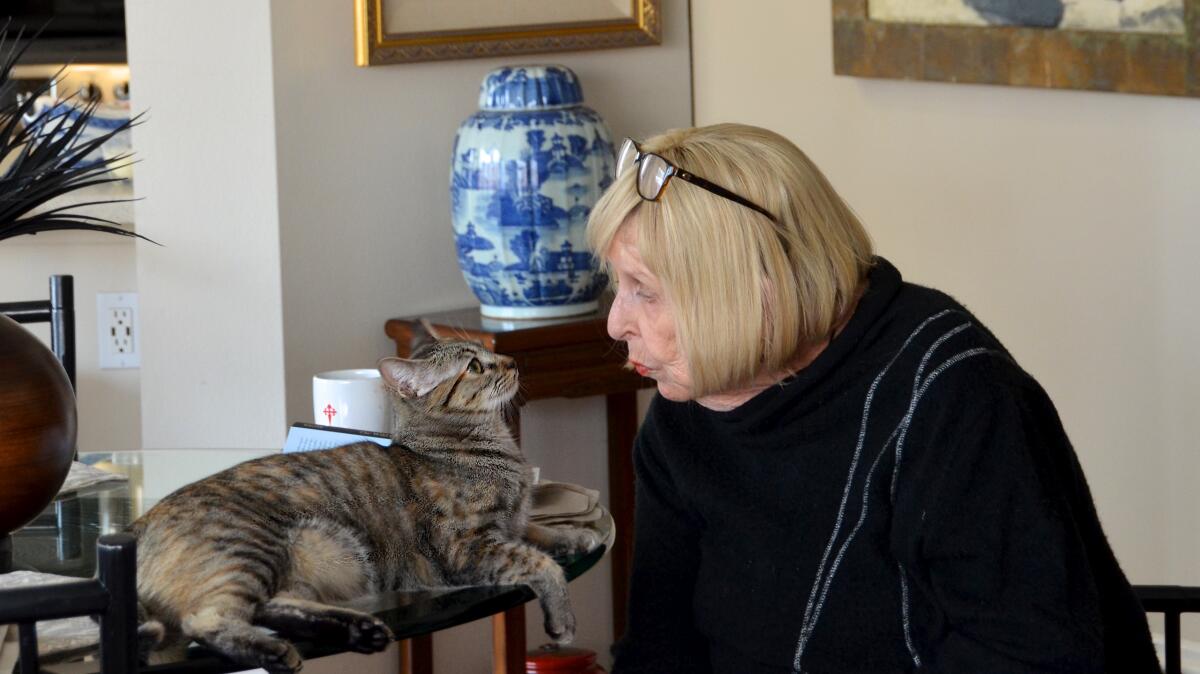 Patricia Hopkins talks to Blue, her gifted cat from Rev. Cindy Voorhees.