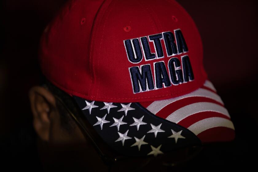 WARREN, MI - OCTOBER 01: A supporters of Former President Donald Trump wears an Ultra Maga hat during a Save America rally on October 1, 2022 in Warren, Michigan. Trump has endorsed Republican gubernatorial candidate Tudor Dixon, Secretary of State candidate Kristina Karamo, Attorney General candidate Matthew DePerno, and Republican businessman John James ahead of the November midterm election. (Photo by Emily Elconin/Getty Images)