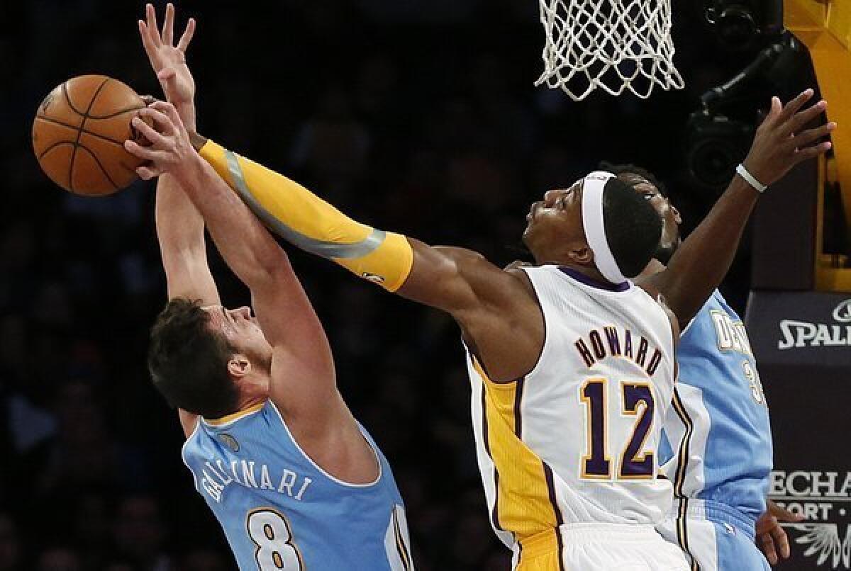 Dwight Howard blocks Nuggets forward Danilo Gallinari's shot.