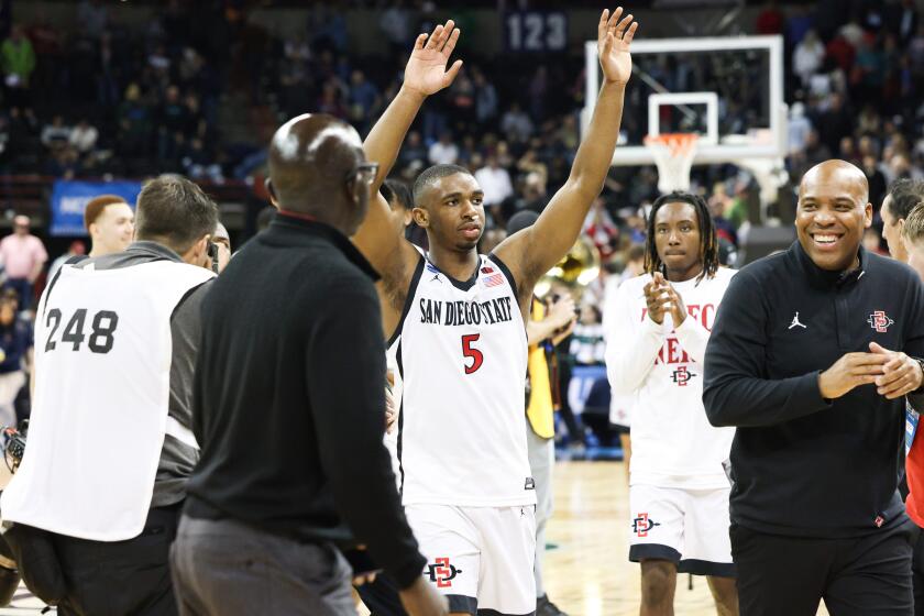 Spokane, WA - March 22: San Diego State guard Lamont Butler (5) acknowledges the crowd after the Aztecs beat UAB during the first round of the NCAA tournament at Spokane Arena on Friday, March 22, 2024 in Spokane, WA.(Meg McLaughlin / The San Diego Union-Tribune)