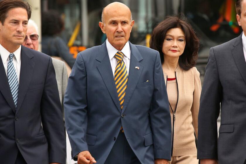 LOS ANGELES, CA - MAY 12, 2017 - Former Los Angeles County sheriff Lee Baca walks with his wife and attorney's to the U.S. Courthouse in Los Angeles for his scheduled sentencing on Friday, May 12, 2017. Baca was found guilty of obstruction of justice, conspiracy and making false statements in connection with an effort to obstruct an FBI probe into corruption and brutality by jail deputies. (Al Seib / Los Angeles Times)