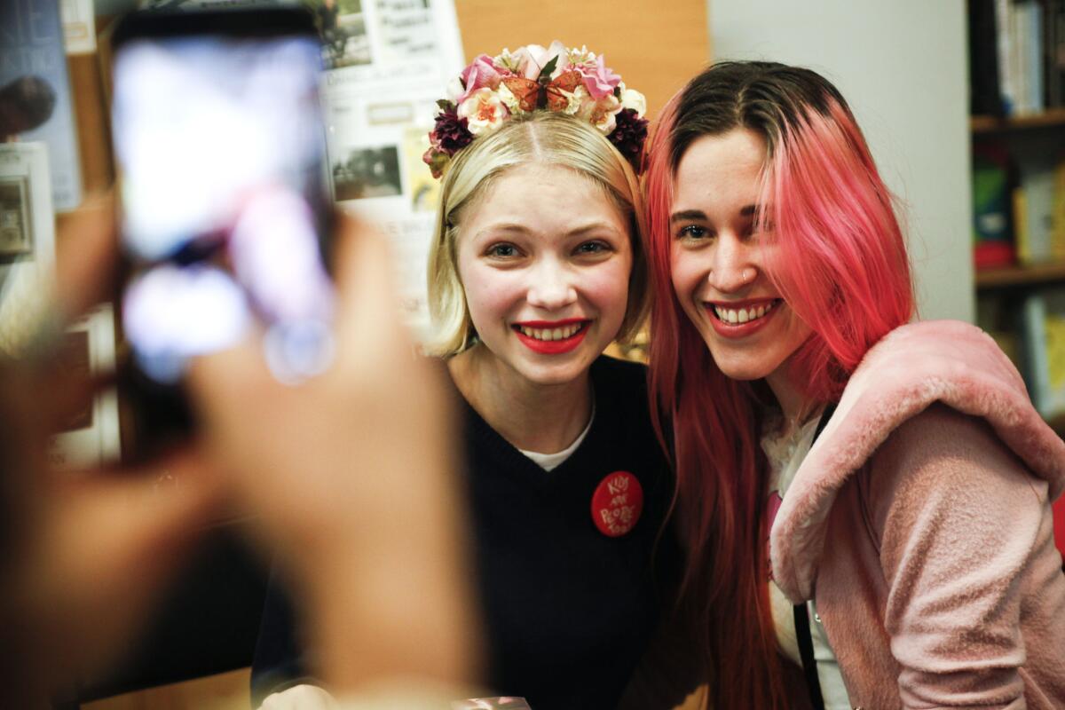 After a signing and reading of Rookie magazine at Skylight Books in Los Angeles, Tavi Gevinson, left, pauses for a photo with reader Gigi Mayer.