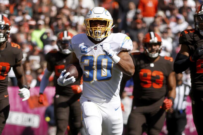 Los Angeles Chargers running back Austin Ekeler (30) runs with the ball.