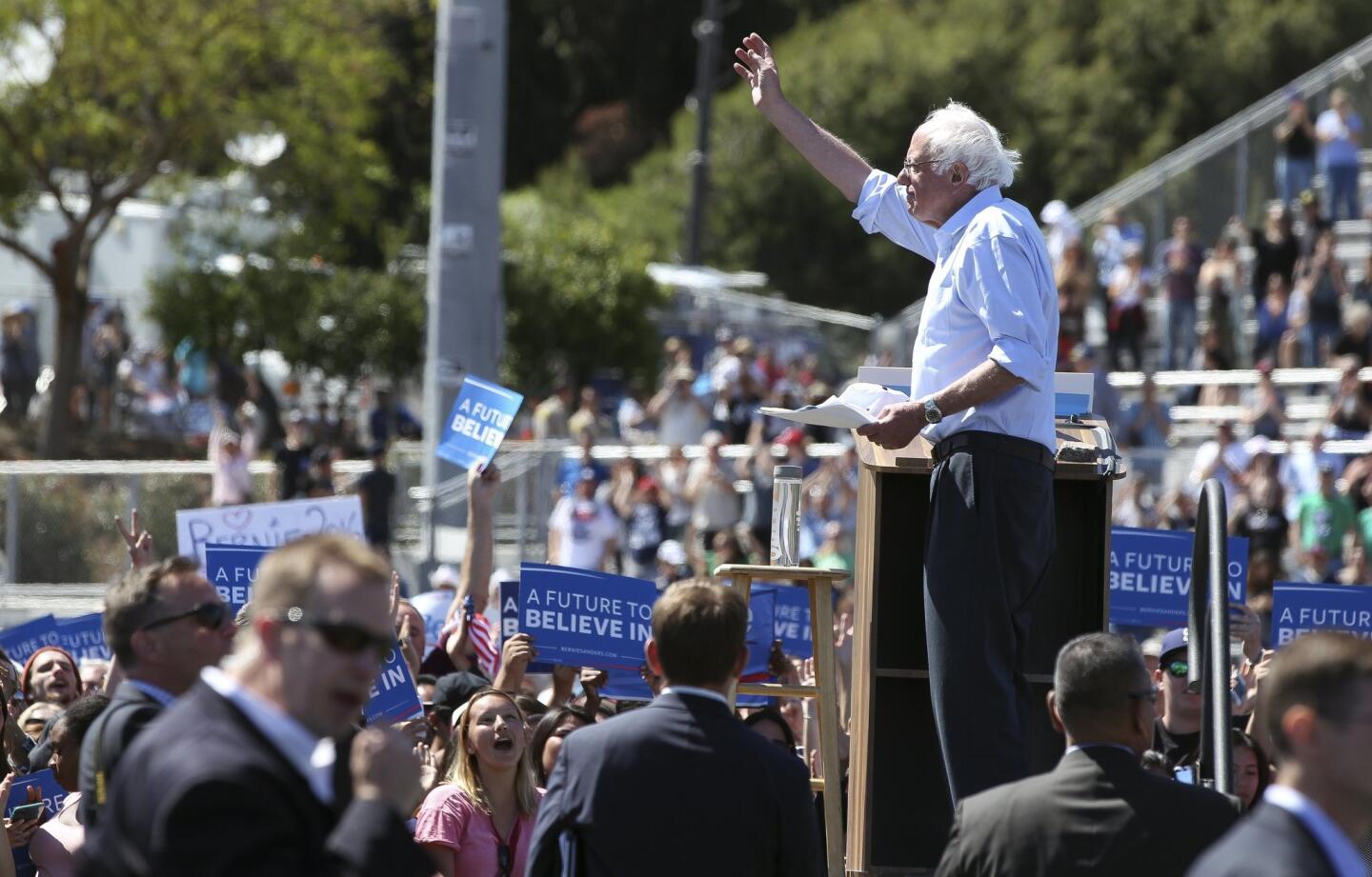 Democratic presidential candidate Bernie Sanders waves to the crowd at the conclusion of his speech.
